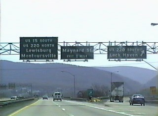 Old sign gantry with circa 1970s guide signs