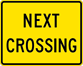 Next Crossing Plaque (W10-14P Image of a Next Crossing Plaque (W10-14P)