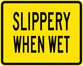 Image of a Slippery When Wet Plaque (W8-5P)