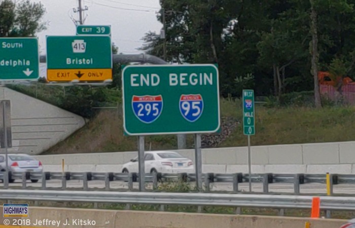 Picture of mile marker 0 and the sign denoting the western end of Interstate 295 at Interstate 95 and the Pennsylvania Turnpike