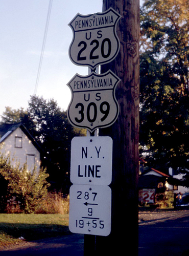 Picture showing US 220 and US 309 markers at their northern terminus in 1961